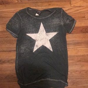 Sheer green shirt with white star on front